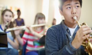 young student playing trumpet obtained through Houston band instrument rentals